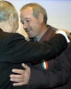 Il Presidente Ciampi abbraccia il Signor Antonio, papà di Luigi Piccolo, dopo avergli consegnato la Medaglia d'Oro al Valor Civile, durante la cerimonia alla Casa di Nazareth.
