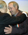 Il Presidente Ciampi abbraccia il Signor Antonio, papà di Luigi Piccolo, dopo avergli consegnato la Medaglia d'Oro al Valor Civile, durante la cerimonia alla Casa di Nazareth.